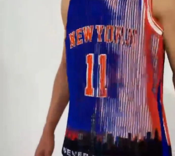 Concept jersey from the front: NEW YORK and the number 11 in orange on blue-and-orange lenticular stripes, a city skyline along the hem.